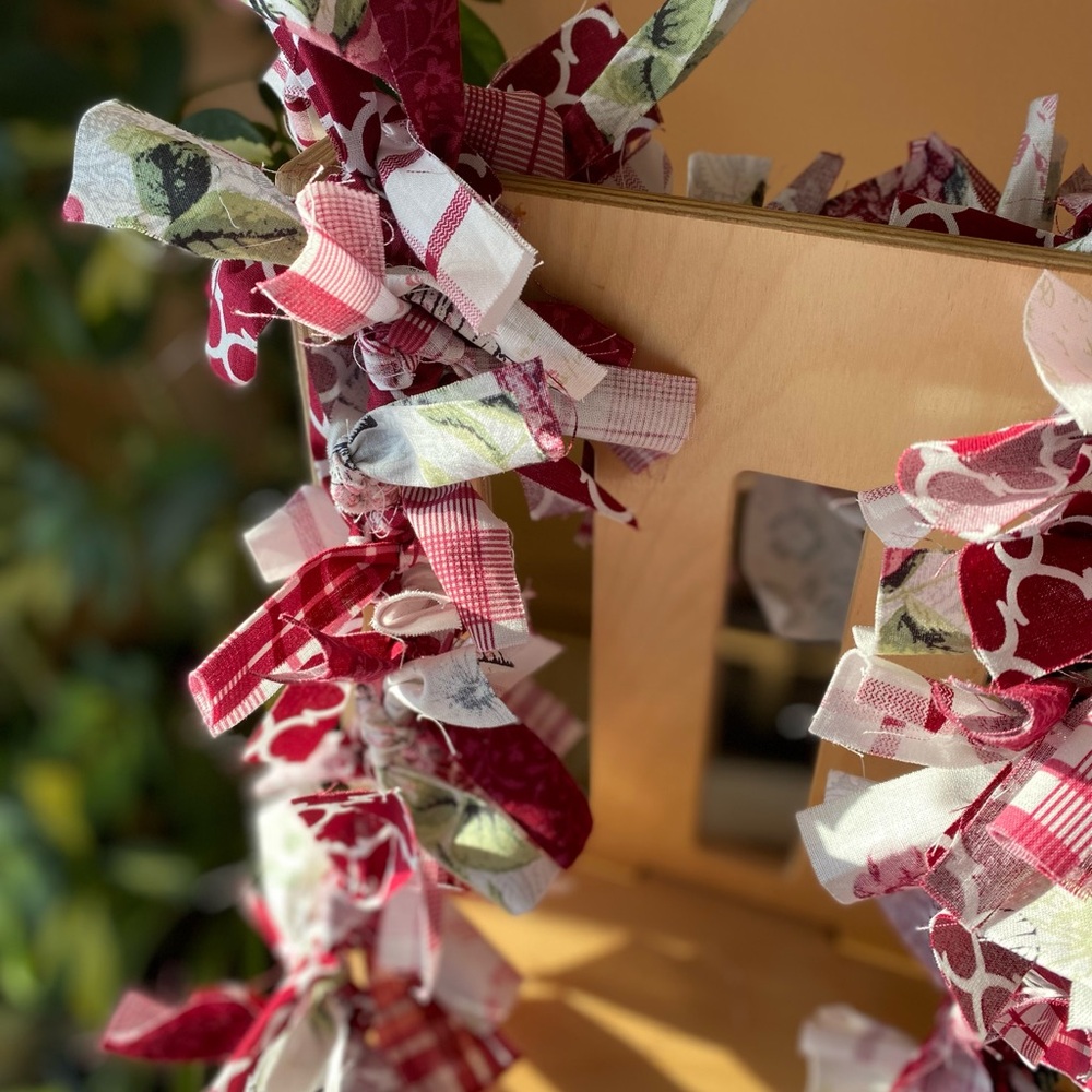 Primitive Red and White fabric garland with splashes of pink, green and black